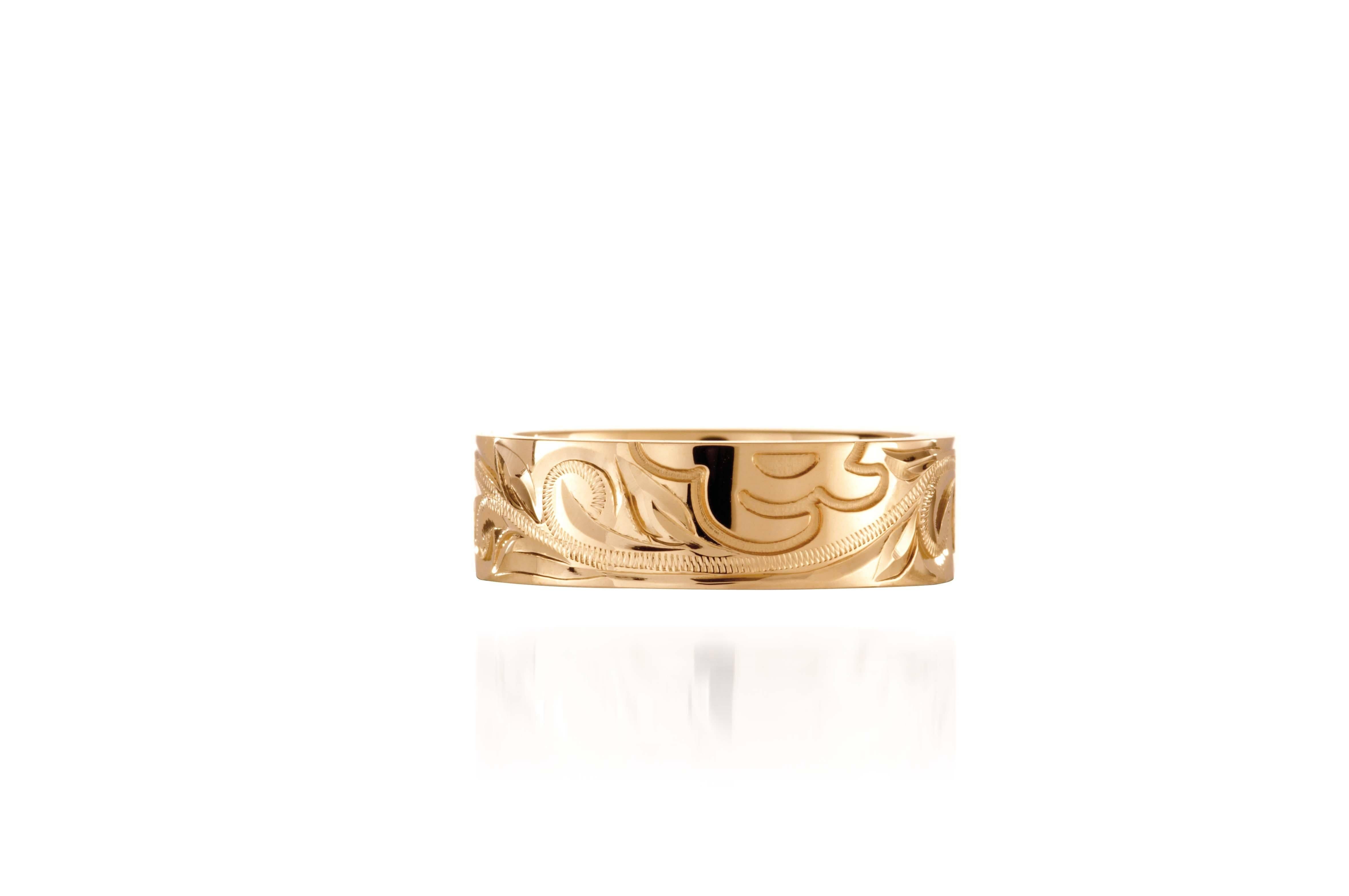 The picture shows a 14K yellow gold sea turtle naupaka 6 mm ring.