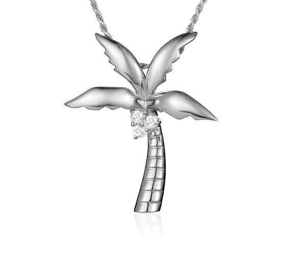 In this photo there is a large white gold palm tree pendant with three diamond coconuts.