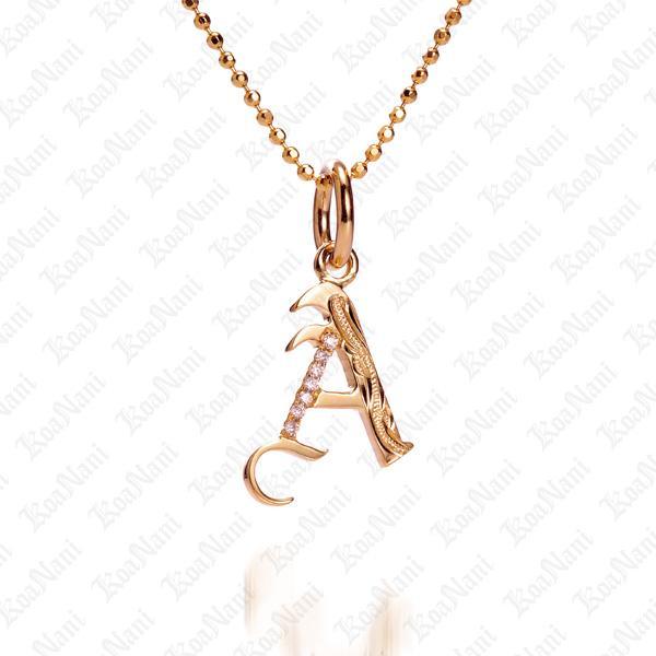 The picture shows a 14K yellow gold Koa Nani A initial pendant.