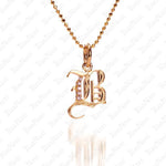 The picture shows a 14K yellow gold Koa Nani B initial pendant.