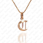 The picture shows a 14K yellow gold Koa Nani C initial pendant.