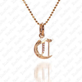 The picture shows a 14K yellow gold Koa Nani C initial pendant.