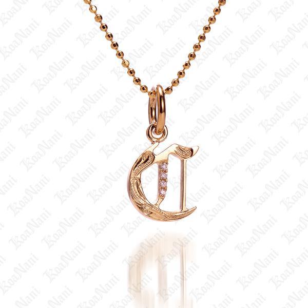 The picture shows a 14K yellow gold Koa Nani C initial pendant.