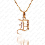 The picture shows a 14K yellow gold Koa Nani D initial pendant.