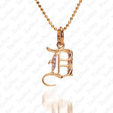 The picture shows a 14K yellow gold Koa Nani D initial pendant.