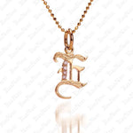 The picture shows a 14K yellow gold Koa Nani E initial pendant.