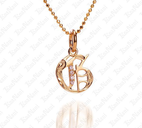 The picture shows a 14K yellow gold Koa Nani G initial pendant.