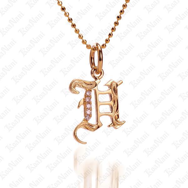 The picture shows a 14K yellow gold Koa Nani H initial pendant.