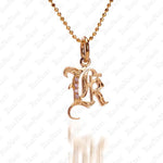 The picture shows a 14K yellow gold Koa Nani K initial pendant.