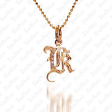 The picture shows a 14K yellow gold Koa Nani K initial pendant.