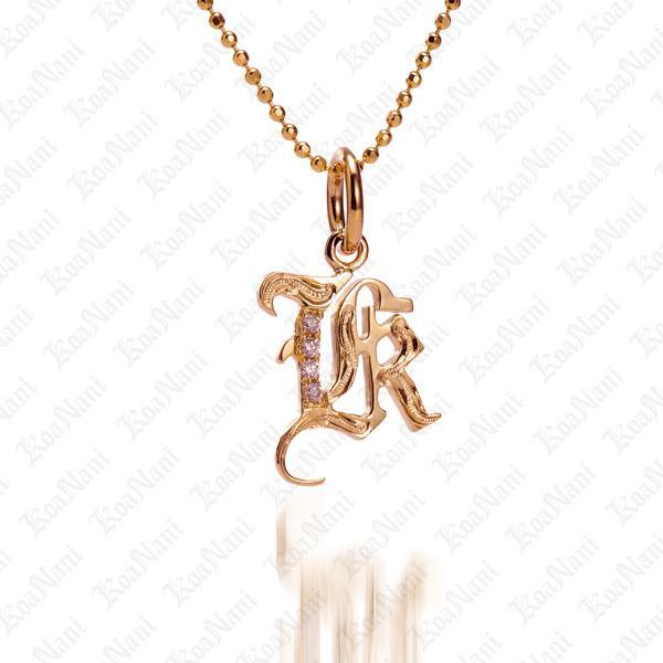 The picture shows a 14K yellow gold Koa Nani K initial pendant.