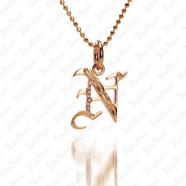 The picture shows a 14K yellow gold Koa Nani N initial pendant.