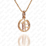 The picture shows a 14K yellow gold Koa Nani O initial pendant.