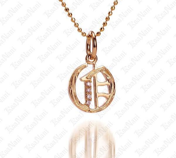 The picture shows a 14K yellow gold Koa Nani O initial pendant.