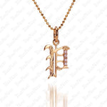 The picture shows a 14K yellow gold Koa Nani P initial pendant.
