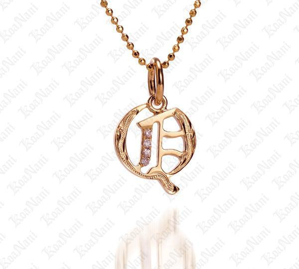 The picture shows a 14K yellow gold Koa Nani Q initial pendant.