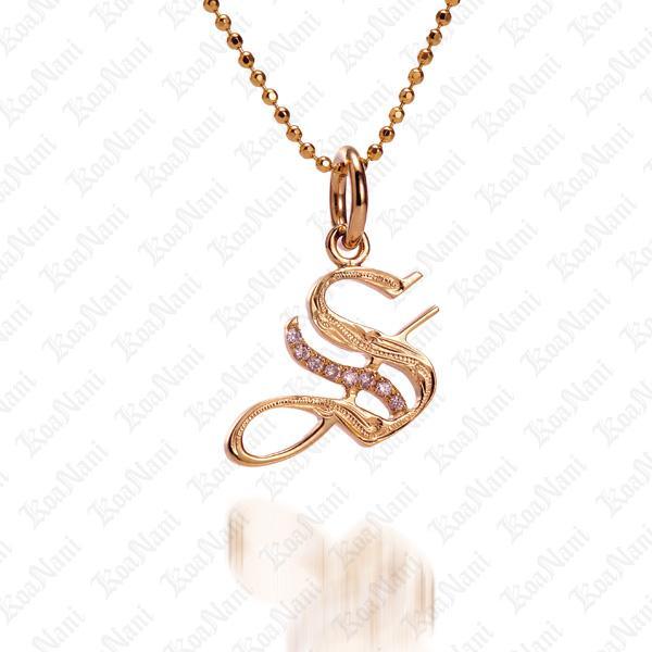 The picture shows a 14K yellow gold Koa Nani S initial pendant.