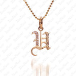 The picture shows a 14K yellow gold Koa Nani U initial pendant.