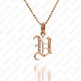 The picture shows a 14K yellow gold Koa Nani V initial pendant.