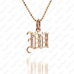 The picture shows a 14K yellow gold Koa Nani W initial pendant.
