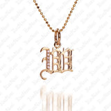 The picture shows a 14K yellow gold Koa Nani W initial pendant.
