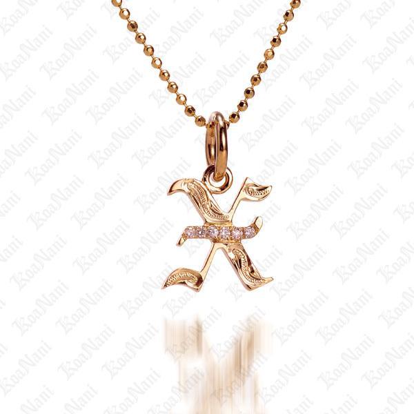 The picture shows a 14K yellow gold Koa Nani X initial pendant.