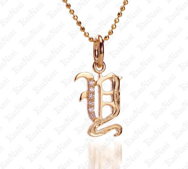The picture shows a 14K yellow gold Koa Nani Y initial pendant.