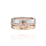 The picture shows a 14K white gold, yellow, and rose gold, tri-color rings. The rose gold heart ring features diamonds.