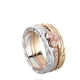 The picture shows a 14K white gold, yellow, and rose gold, tri-color rings. The rose gold heart ring features diamonds.