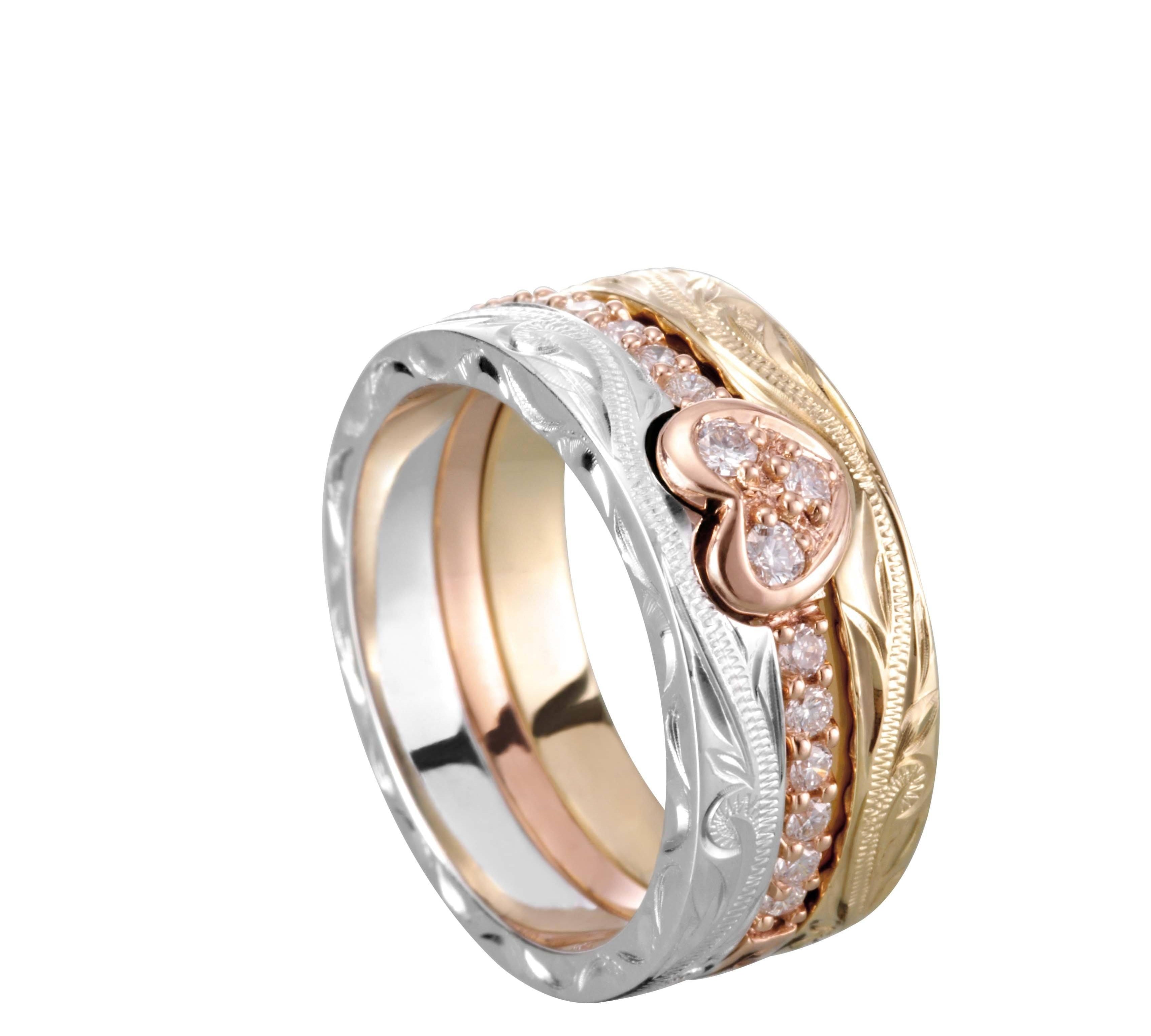 The picture shows a 14K white gold, yellow, and rose gold, tri-color rings. The rose gold heart ring features diamonds.