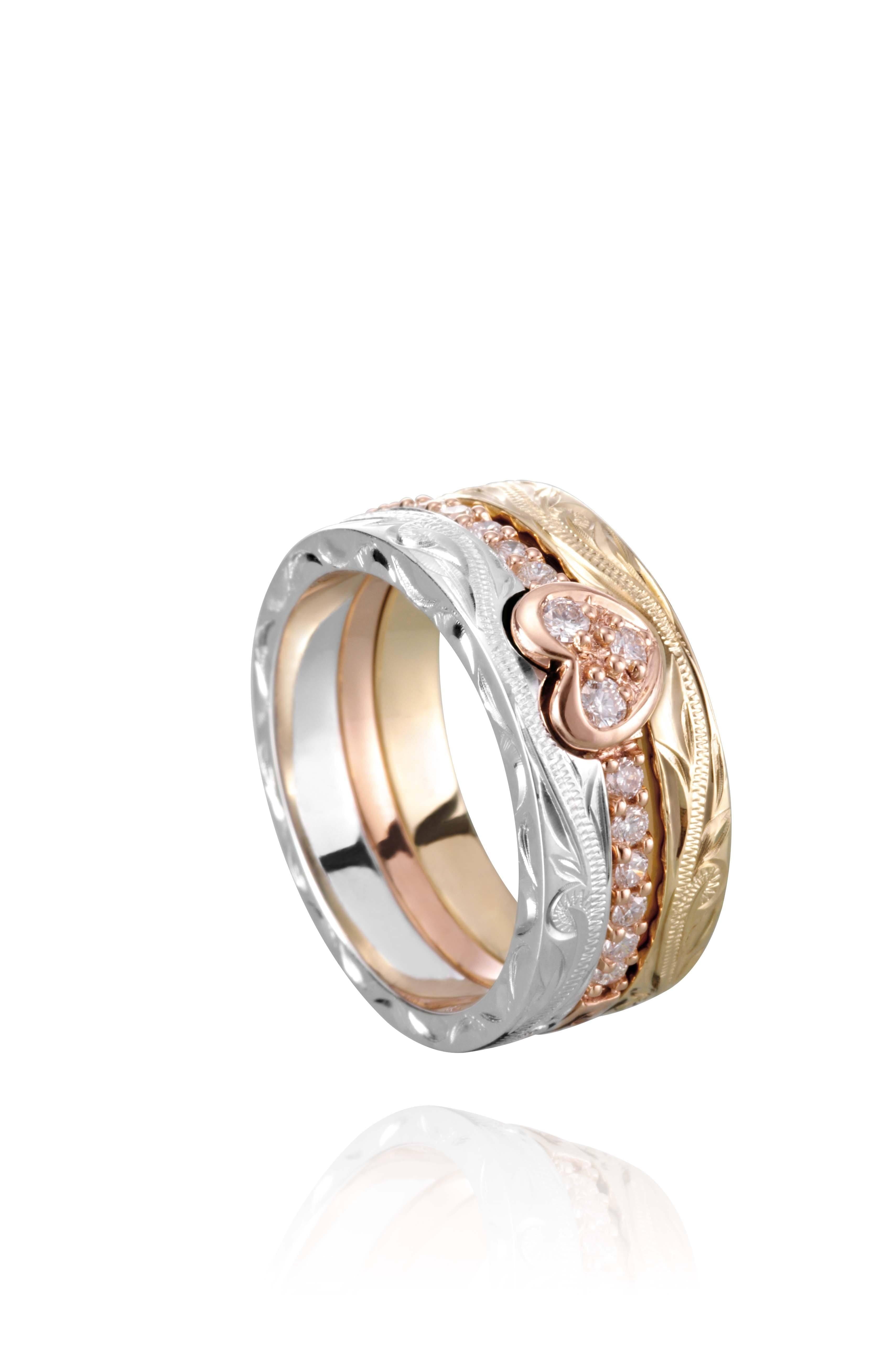 The picture shows a 14K white gold, yellow, and rose gold, tri-color rings. The rose gold heart ring features diamonds.