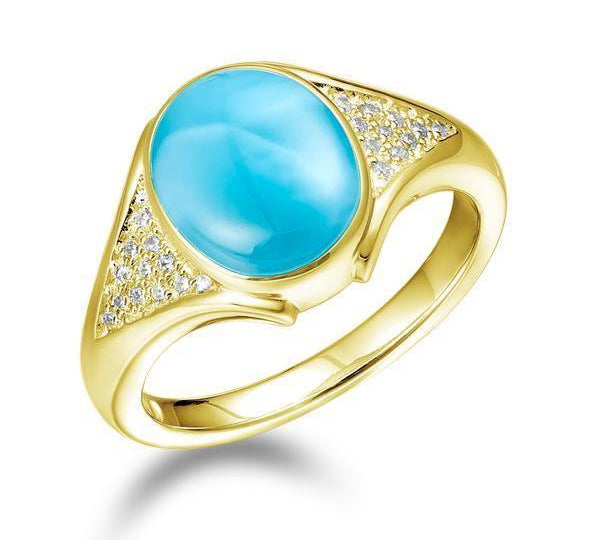 The picture shows a 14K yellow gold larimar cocktail ring with diamonds.