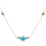The picture shows a 14K yellow gold necklace with three larimar gemstones paired with diamonds and two aquamarine gemstones.