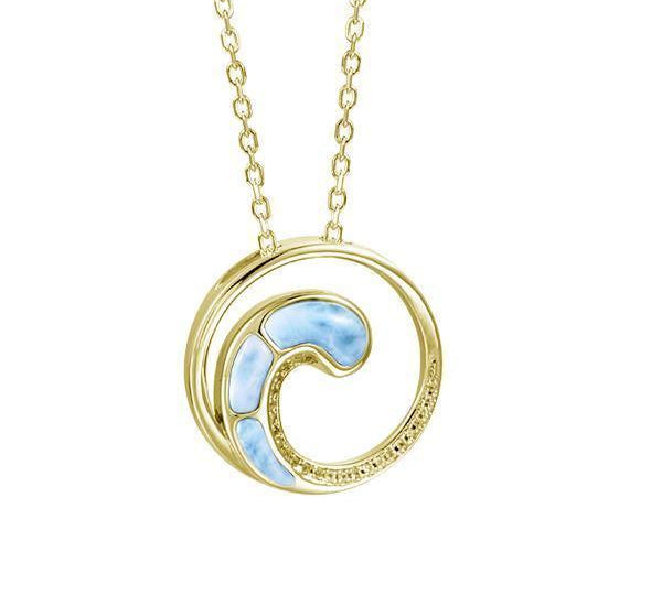In this photo there is a yellow gold circle pendant with a wave and blue larimar gemstones.