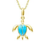 The picture shows a 14K yellow gold sea turtle pendant with larimar gemstones.