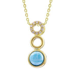 This photo shows a 14K yellow gold larimar three circle pendant with diamonds.