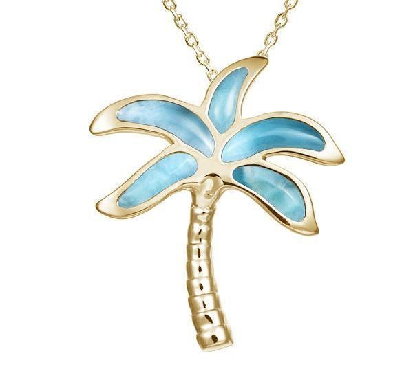 In this photo there is a yellow gold palm tree pendant with blue larimar gemstones.