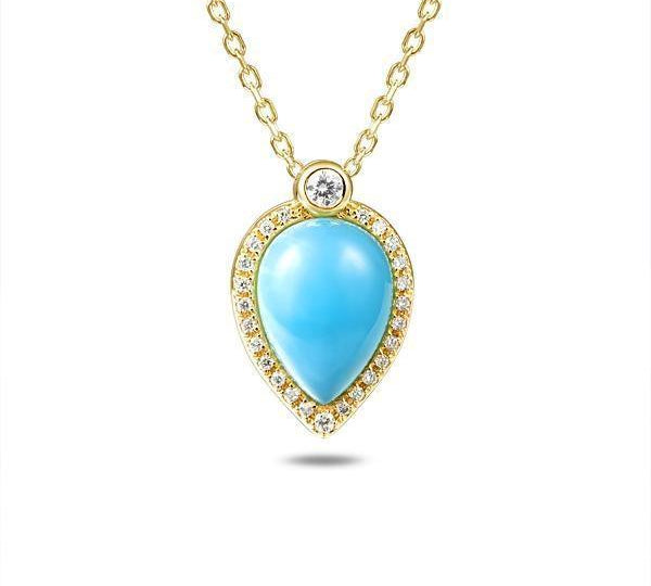 In this photo there is a yellow gold petal pendant with a center diamond and blue larimar gemstone surrounded by smaller diamonds.
