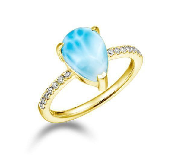 The picture shows a 14K yellow gold larimar petal ring with a diamond band.