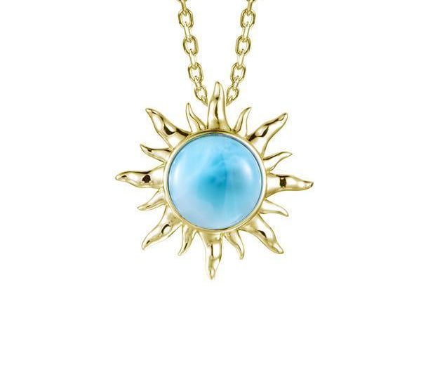 In this photo there is a pair of yellow gold sun pendant with one blue larimar gemstone.