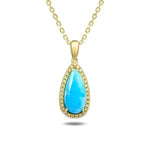 The picture shows a 14K yellow gold larimar teardrop pendant with diamonds.