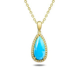 The picture shows a 14K yellow gold larimar teardrop pendant with diamonds.