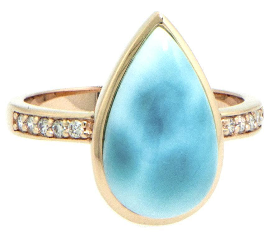 The picture shows a 14K yellow gold larimar teardrop ring with a diamond band.