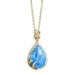 The picture shows a 14K yellow gold larimar tears of joy pendant with topaz and diamonds.