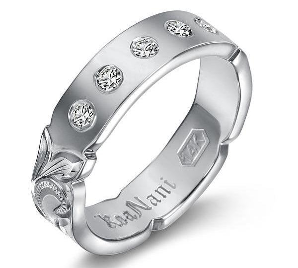 The picture shows a 14K white gold 4mm ring with hand engravings and diamonds.