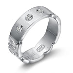 The picture shows a 14K white gold 6mm ring with hand engravings and diamonds.