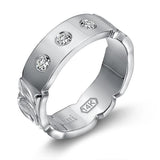 The picture shows a 14K white gold 6mm ring with hand engravings and diamonds.