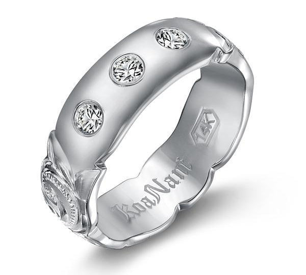 The picture shows a 14K white gold 6mm ring with hand engravings and diamonds.