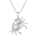 The picture shows a 14K white gold blue crab pendant.