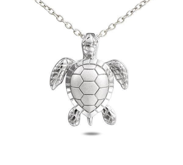 The picture shows a 14K white gold sea turtle pendant with diamonds.